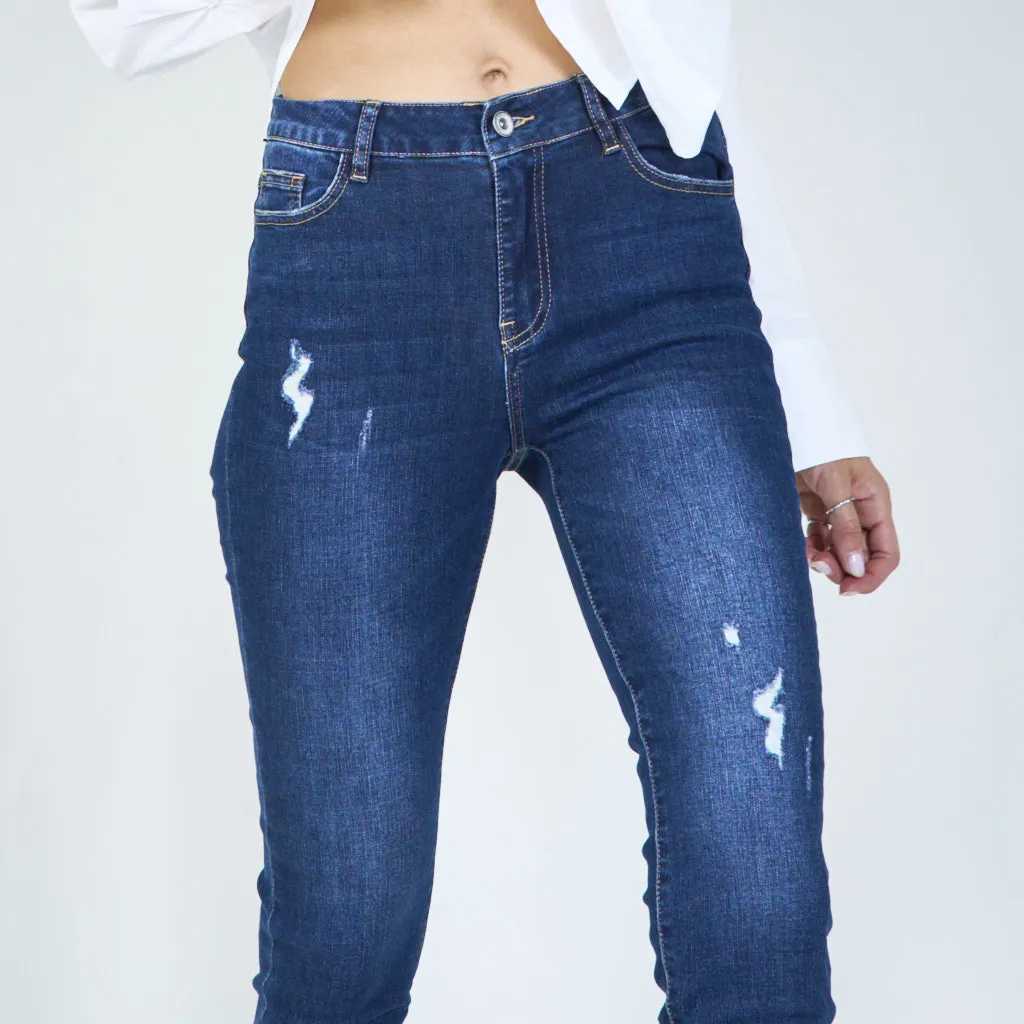 Distressed high-waisted skinny jeans with rolled hem wholesale