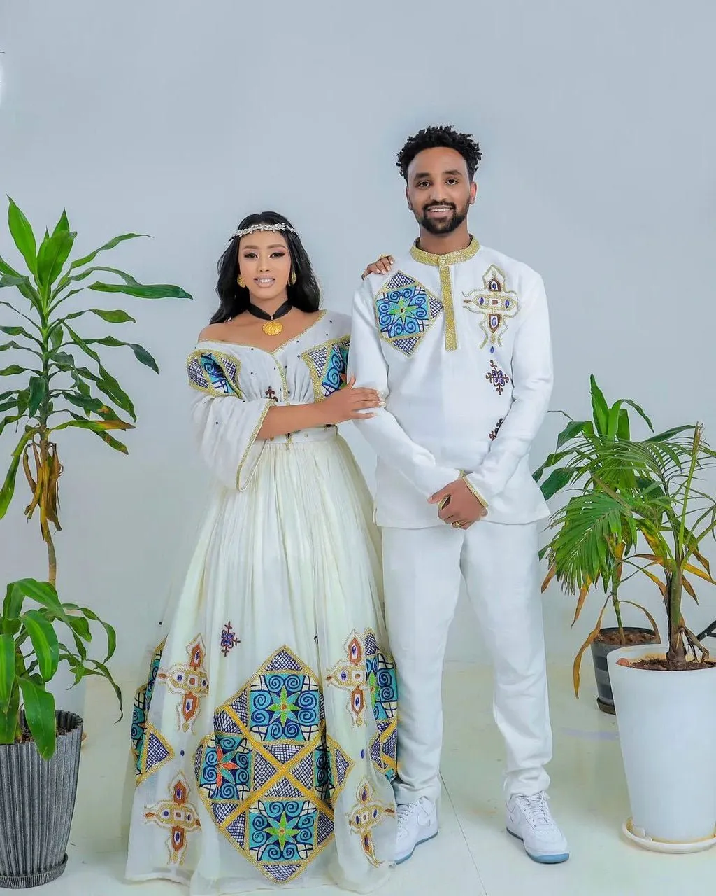 Sapphire Serenade: Ethereal Sparkle in Blue Habesha Couples Wedding Attire